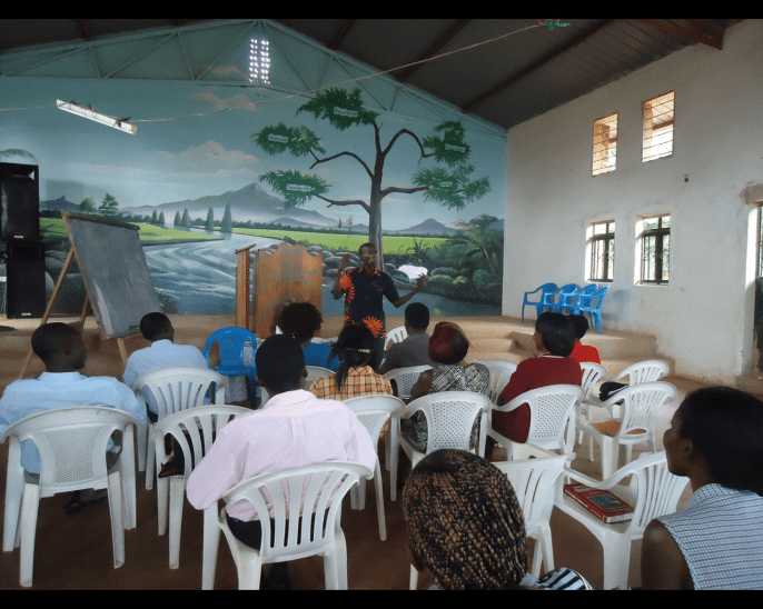 Dan Muwanguzi teaching God's Word to students.