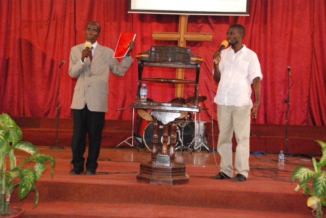 Close up of them speaking and sharing at Deliverance Church. 