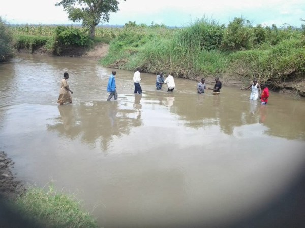 We baptized new believers in a local river in Butaleja. 