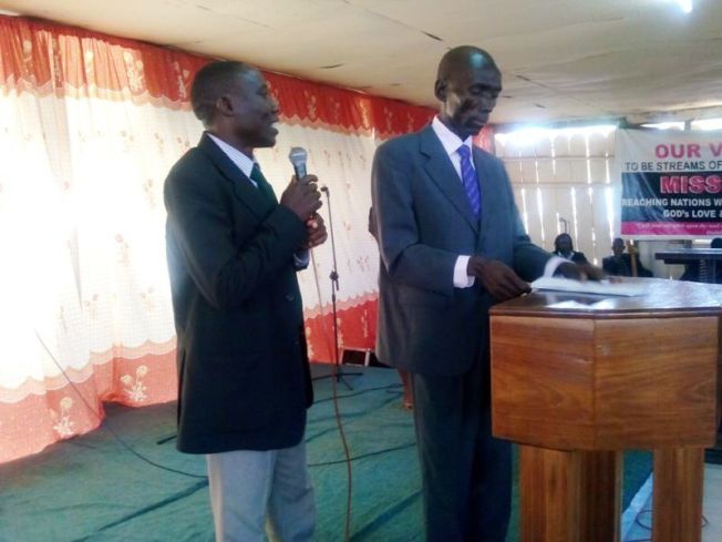 Dan presenting and handing out certificates at the graduation ceremony.