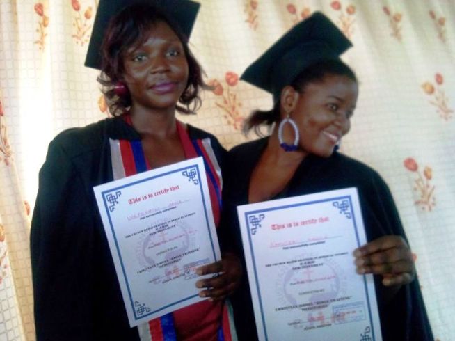 Two happy recent graduates from the 2014 C-TBS cohort. 